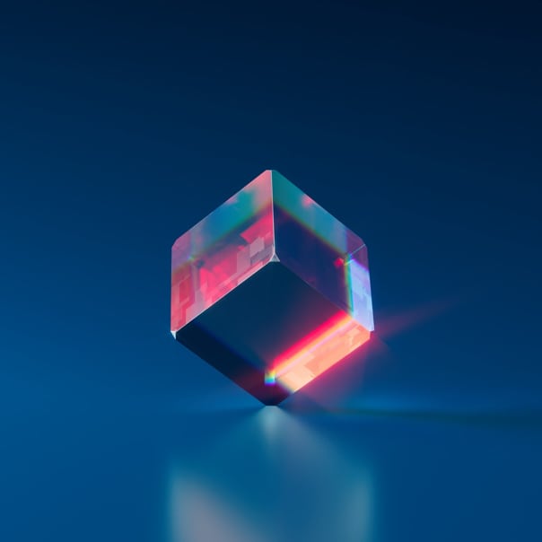 A transparent 3D cube with pink accents on a blue background